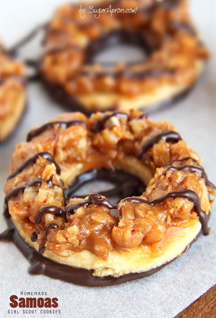 Homemade Samoas Cookies - Even BETTER than the originals! Whip up a batch of your favorite crisp cookies, coated in caramel, sprinkled with toasted coconut, and striped with a dark chocolaty coating.