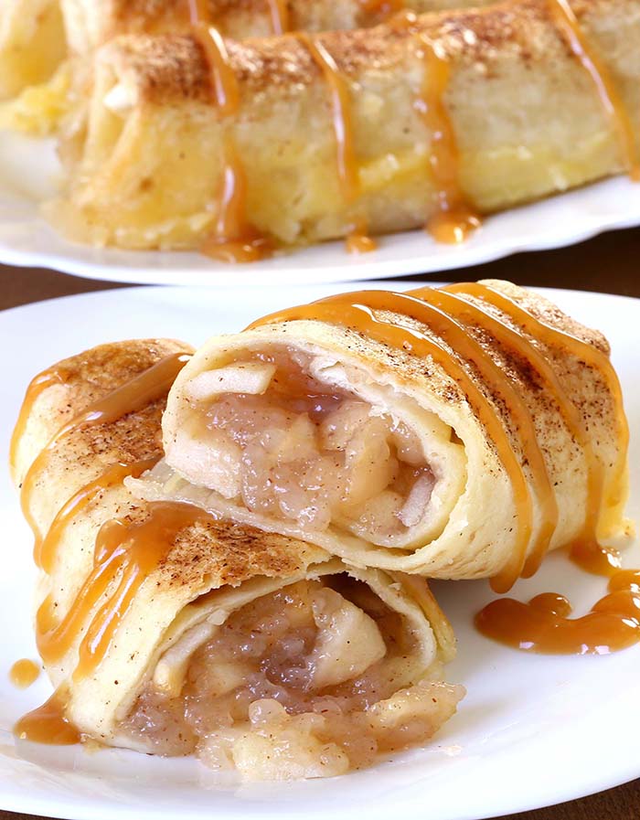 Baked Apple Pie Enchiladas give you all the cinnamony goodness of hot apple pie stuffed securely into a tortilla and drizzled with caramel sauce...