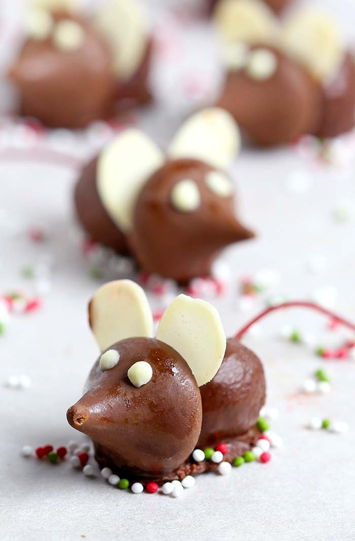 These fun Chocolate Cherry Christmas Mice made from chocolate covered cherries with almond slices and Hershey’s Kisses, are a great addition to your Christmas table.
