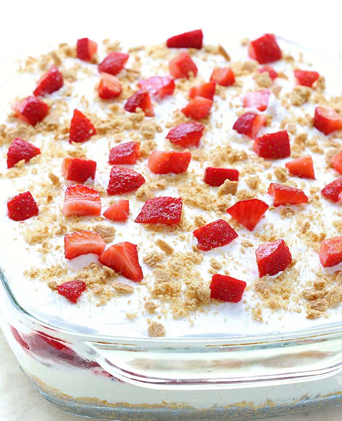 No Bake Strawberry Cheesecake Lasagna will make all Your Strawberries and Cream dreams come true. This is your ticket to becoming a backyard-barbecue legend, perfect for 4th of July or any other family get-togethers. 