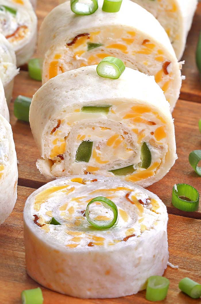 Jalapeno Popper Tortilla Roll Ups are a simple and fun bite sized spin on ever popular jalapeno poppers! Always a crowd pleaser, perfect for game day party.
