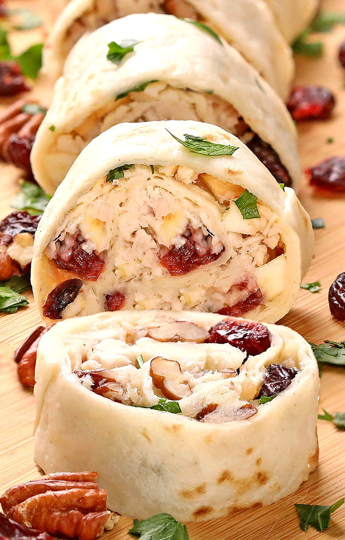 Enjoy easy-to-make Cranberry Pecan Chicken Salad in Tortilla Roll-Ups, Wraps, sandwiches, or straight out of the bowl for a dinner or holiday menu, especially Thanksgiving or Christmas. This is a terrific recipe for using up leftover chicken or turkey