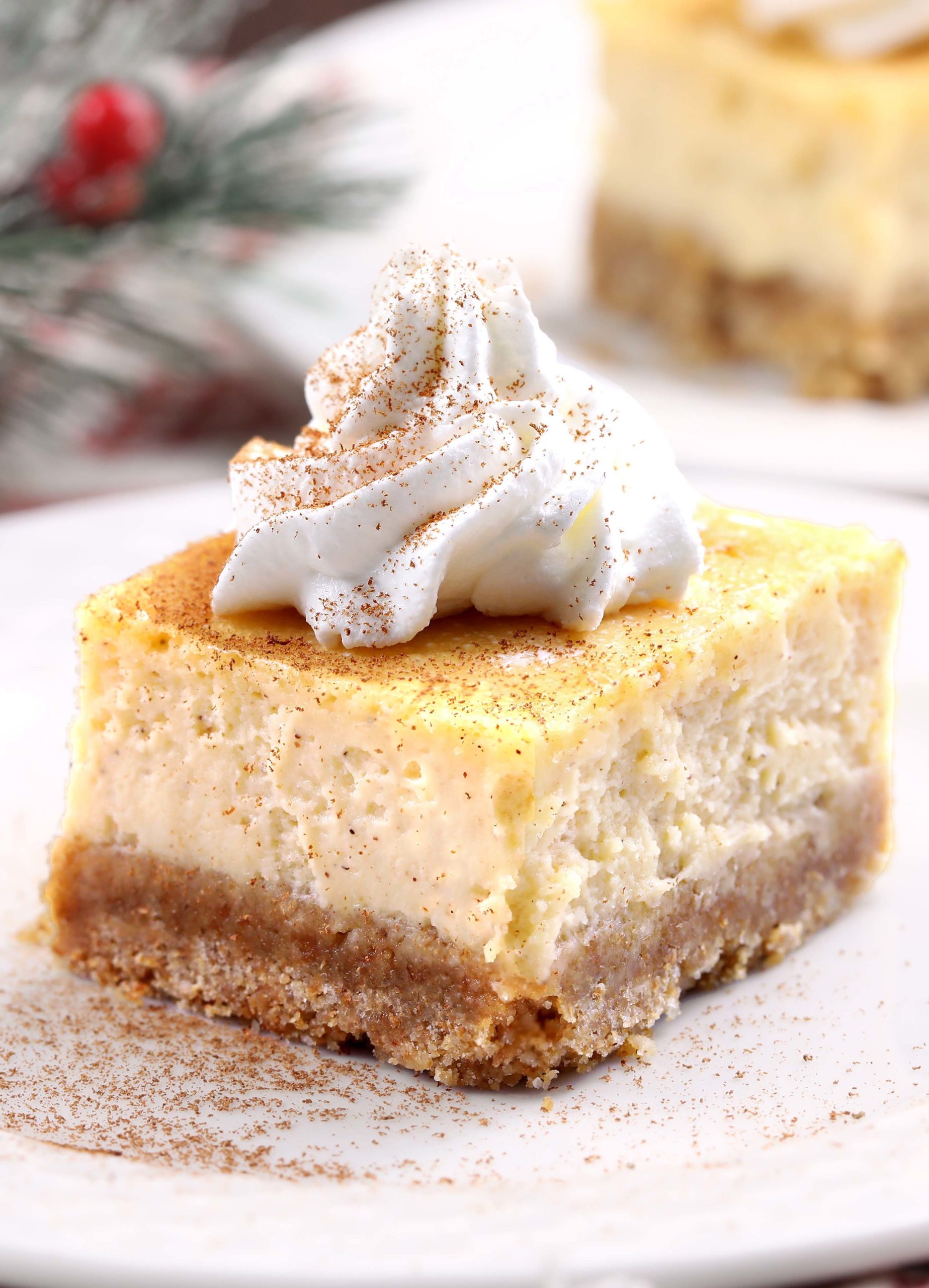 Rich and creamy cheesecake bars with a graham crust and packed with eggnog. Great for the holidays!
