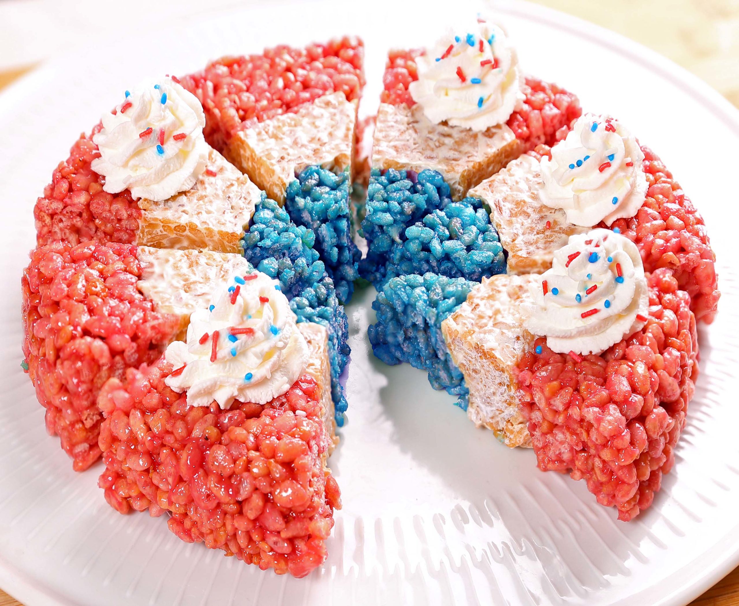 Delicious and Easy to make Red, White, and Blue Rice Krispie Treats Are Always A Hit, And Festive For the 4th of July or Memorial Day, or any Patriotic Occasion.