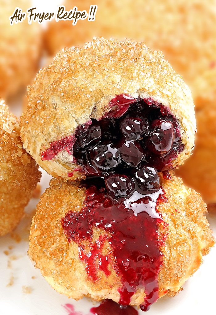 Blueberry Pie Bombs are the perfect treat to bring as a party pleaser, and they couldn’t be easier. Biscuit dough filled with blueberry pie filling, sprinkled with sugar, and cooked in an air fryer! You’ll be enjoying this awesome dessert in about 20 minutes. #blueberry pie